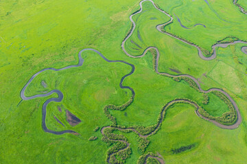 Aerial photography of the nine twists and turns of the Uragai River in the Uragai Grassland in...