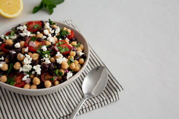 Homemade Chickpea And Black Bean Salad in a Bowl, low angle view. Copy space.