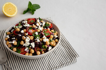 Homemade Chickpea And Black Bean Salad in a Bowl, low angle view. Copy space.