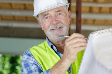 senior engineer builder at construction site