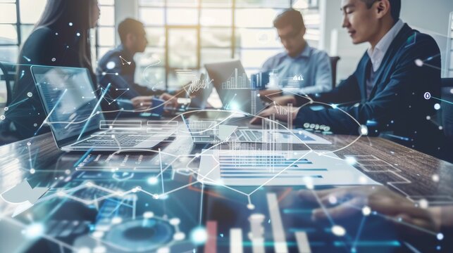 A group of professionals in a meeting with laptops, analyzing data with a digital futuristic overlay of graphs and charts