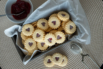 Traditional swiss cookies called Spitzbuben filled with jam.