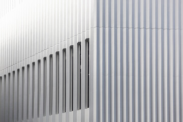 Obraz premium Architecture details of white concrete facade with pleat cement casting technique and voids 