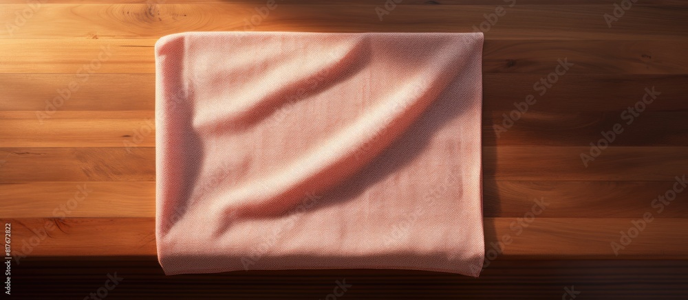 Aufkleber a kitchen towel is placed on a wooden cooking table seen from a top down perspective with room for a