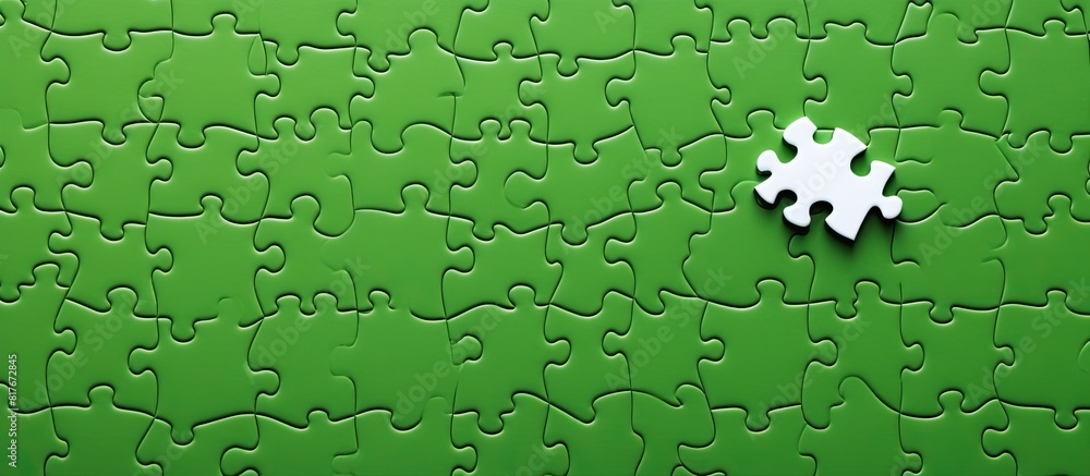 Poster Copy space image of a white jigsaw puzzle fragment alongside scattered puzzle pieces on a green surface Texture photo with room for text