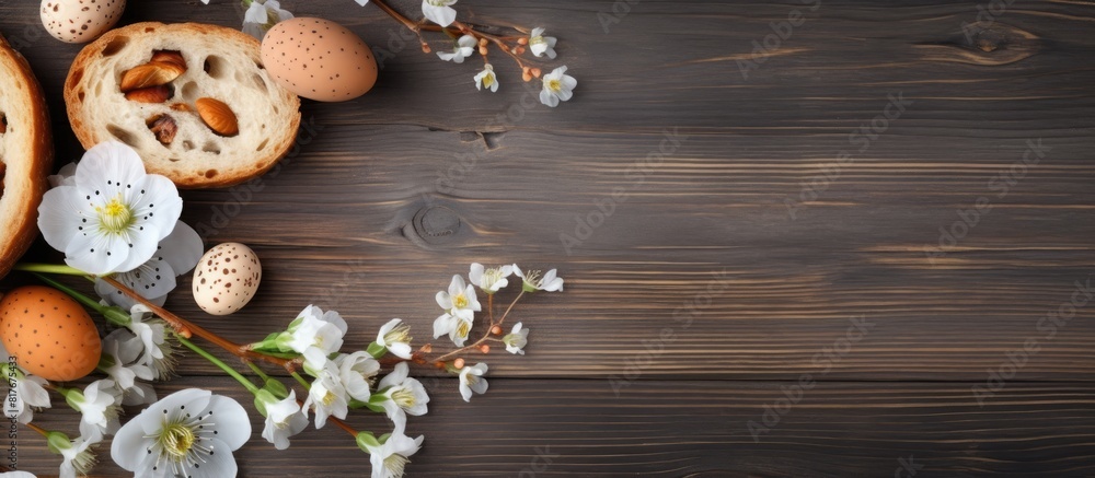Poster toned photo featuring an apricot tree blossom branch quail eggs and rye bread on a wooden background