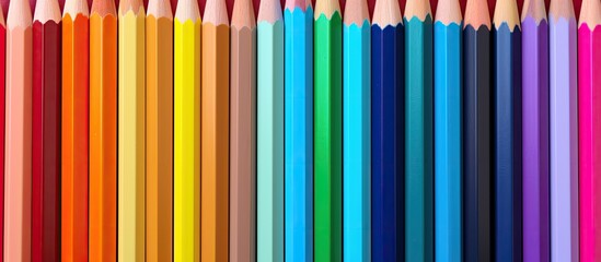 A vibrant array of colored pencils displayed in a copy space image - Powered by Adobe
