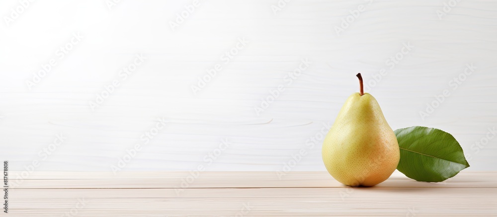 Poster A single pear is displayed on a white wooden table with a background that offers ample copy space for additional elements