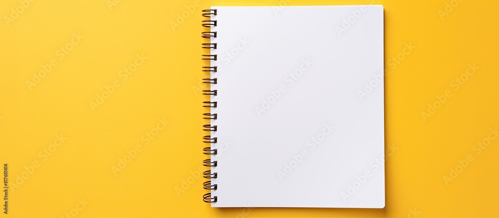 Poster An isolated yellow background with a white open notepad provides plenty of copy space image