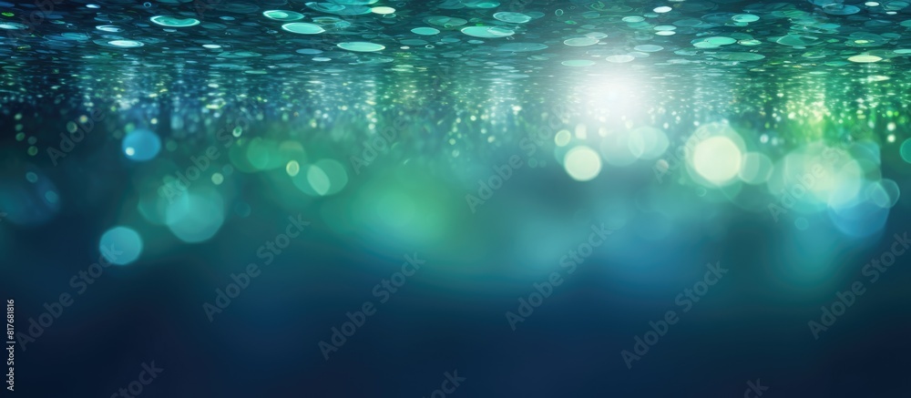 Poster the image showcases a copy space with mesmerizing bokeh lights in shades of green and blue emanating