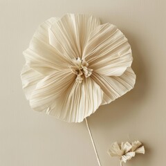 simple flower made of soft RAFFIA isolated on plain background