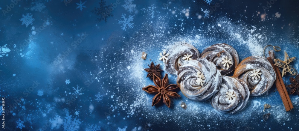 Poster top view of homemade bakery chocolate cookies with powdered sugar and star anise on a blue napkin id