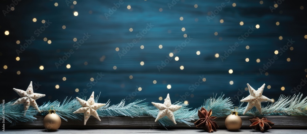 Poster a copy space image of christmas decorations set on a rustic blue wooden table