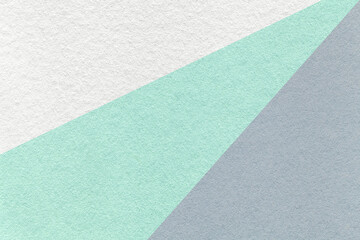 Texture of old craft light white, green and gray color paper background, macro. Vintage abstract pastel cardboard