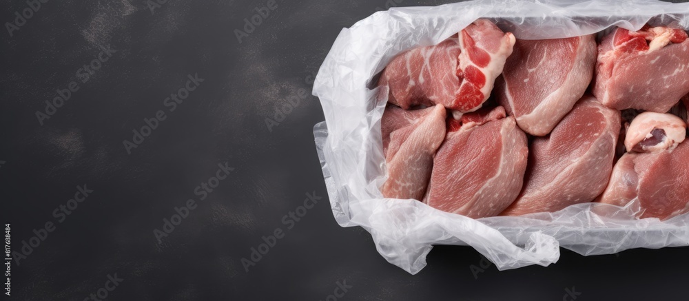Aufkleber Top view of a poultry vacuum packed set placed on a gray stone table background Copy space is available for text placement in the image
