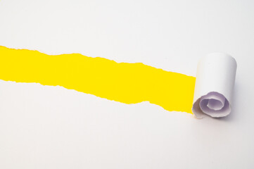 Colorful background, with torn and rolled white sheet

