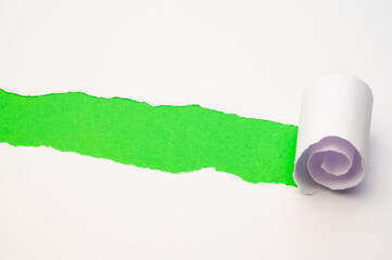 Colorful background, with torn and rolled white sheet
