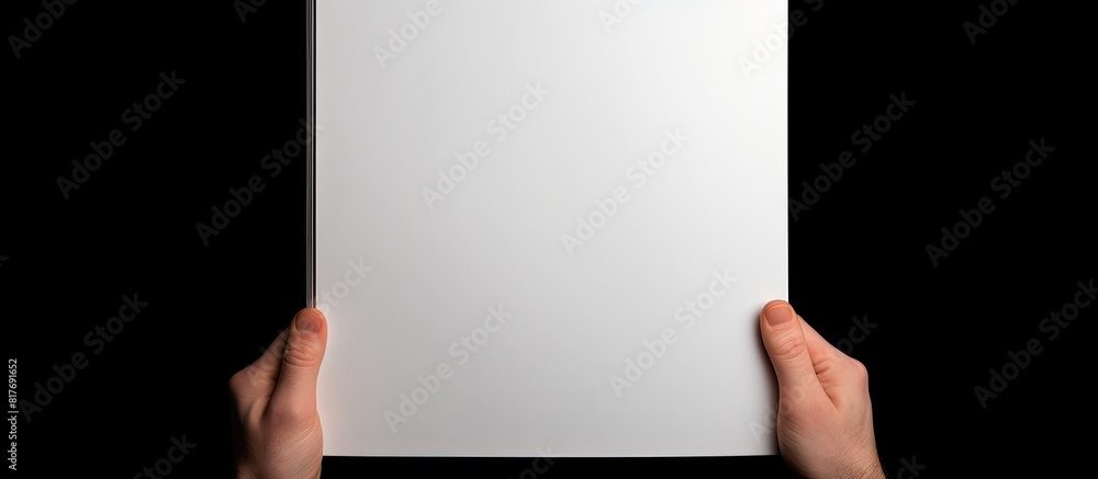 Poster a5 open book mockup held by hands showcasing a blank page for design isolated on a white background 