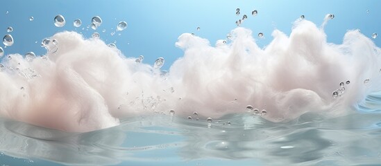 Copy space image of soapsuds floating on a textured background of water