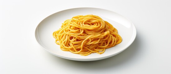A copy space image of spaghetti is presented on a white plate against a clear background