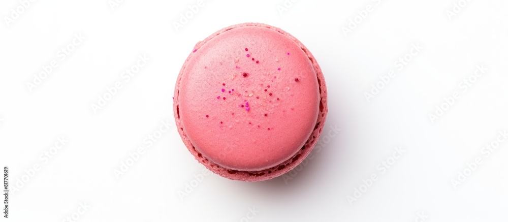 Poster A top down view of a sweet hazelnut pink macaroon isolated on a white background with a flat lay composition and copy space image