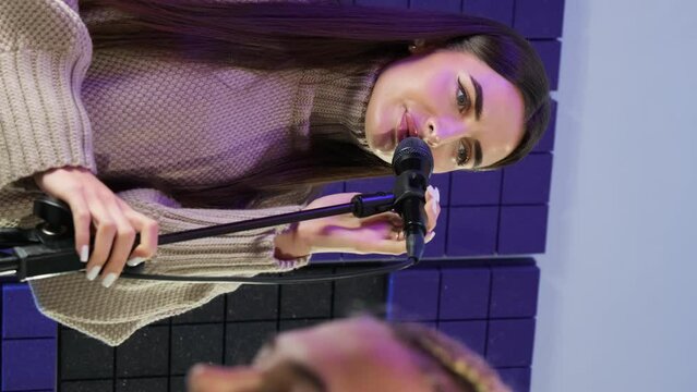 Student explores diverse repertoire of musical genres. Women broaden musical horizons fostering artistic versatility during lesson