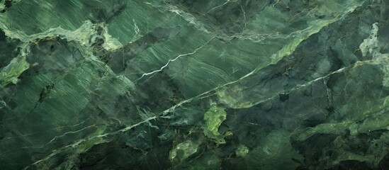 Naklejka premium A textured surface of raw green marble stone provides a captivating copy space image