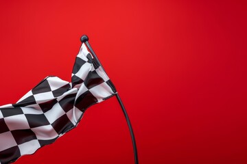 Checkered flag with black and white waves on red background space for text flagpole visible