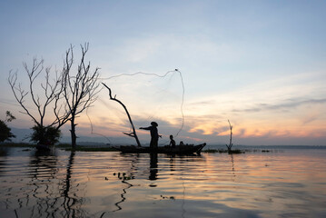 Fisherman of Lake in action when fishing, Thailand