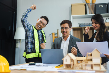 Person's engineer Hand Drawing Plan On Blue Print with architect equipment, Architects discussing at the table, team work and work flow construction concept.