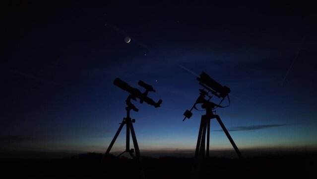 Astronomical telescope and camera on a startracker tripod for observing and capturing stars, planets, Moon and other cosmic celestial objects.	
