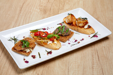 bruschetta with different vegetables and meat