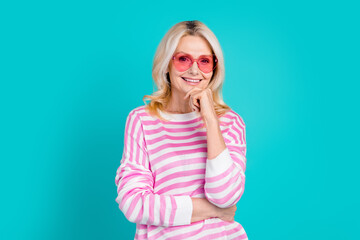 Portrait of intelligent senior person wear striped pullover in heart shape glasses hold hand on...