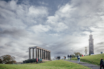 Tourists Walking Near Edinburgh Monuments