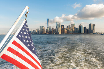 united states flag.new york, manhattam skyline, view of united states flag with manhattam skyline. 