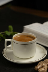 Steaming cup of cappuccino topped with foam