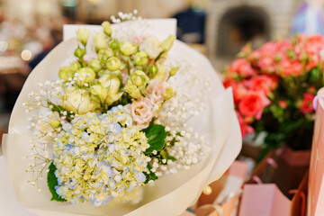 Large beautiful bouquets of different delicate flowers. A traditional gift for the holiday.
