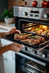 a woman takes steaks out of the oven. selective focus