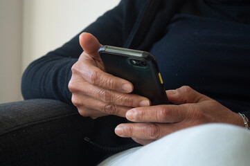 a woman's hand holding a cell phone