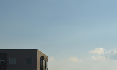 a part of a building and the sky