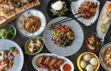 Top view of various Asian dishes on the table