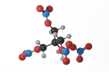 Ball and stick model of pentaerythritol tetranitrate (PETN) molecule against a white background