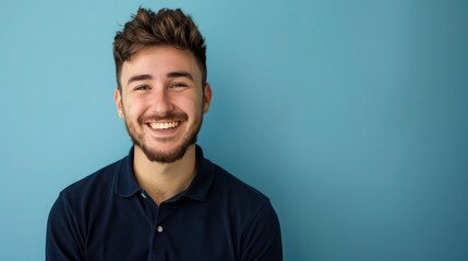 Smiling Man Facing Camera in Dark Blue Navy Polo, Light Blue Background, Ideal for Promotional and Marketing Materials