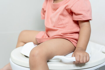 child going to the toilet, constipation in children, dyspepsia, abdominal pain, crying, defecating,...
