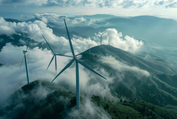 Fototapeta premium wind turbines on top mountain with clouds and fog 