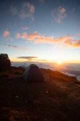 A tranquil sunset view from a mountain campsite.