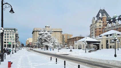 Winter wonderland scene fills the frame as a charming street in Victoria, BC, Canada