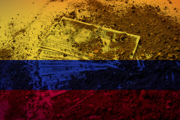 American dollars under the ground with Colombia flag, dirty money in Colombia concept, corruption 