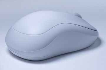 White wireless computer mouse on white background