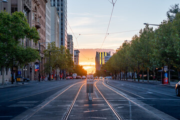 View along tram tracks at North Terrace Adelaide at sunset